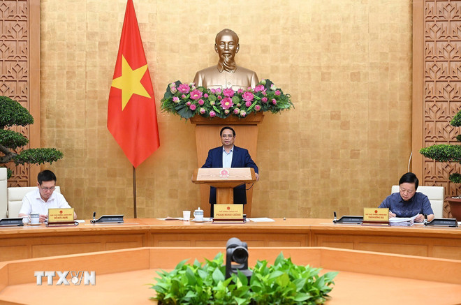 Thủ tướng Phạm Minh Chính chủ trì cuộc họp Chính phủ về tháo gỡ khó khăn, vướng mắc trong thực hiện chính quyền địa phương hai cấp. (Ảnh: Dương Giang/TTXVN) ttxvn-thu-tuong-chu-tri-cuoc-hop-thao-go-vuong-mac-chinh-quyen-dia-phuong-hai-cap2.jpg